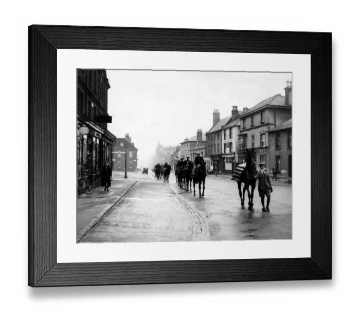 Framed Print : Racehorses pass through Newmarket on their way to the gallops in 1932 Framed Print : Racehorses pass through Newmarket on their way to the gallops in 1932