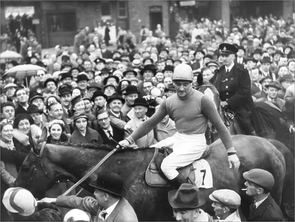 Jockey, Fred Winter, with racehorse Sundew after winning the 1957 Grand National