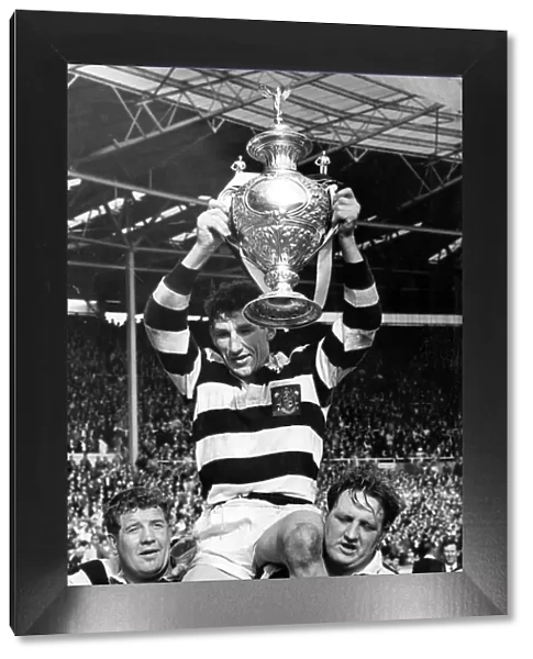 Widnes captain Vik Karalius holds trophy aloft after victory over Hull Kingston Rovers in Rugby League Cup Final 1964