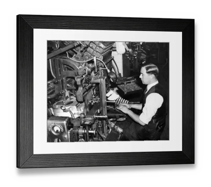 Framed Print : A newspaper compositor at work