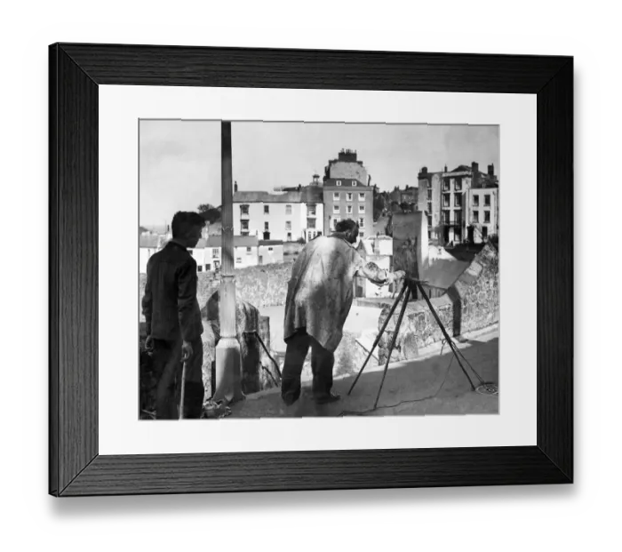 Framed Print : An artist painting the harbour in Tenby Framed Print : An artist painting the harbour in Tenby