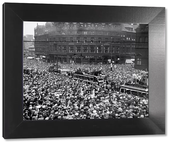 Cheering crowds greet Sheffield Wednesday team as they arrive home with the F. A. Cup 1935