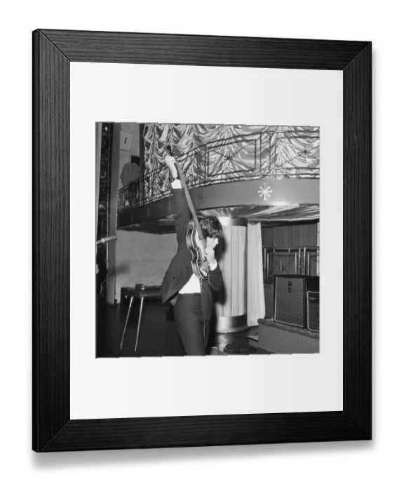 Framed Print : Paul McCartney tunes his guitar Framed Print : Paul McCartney tunes his guitar