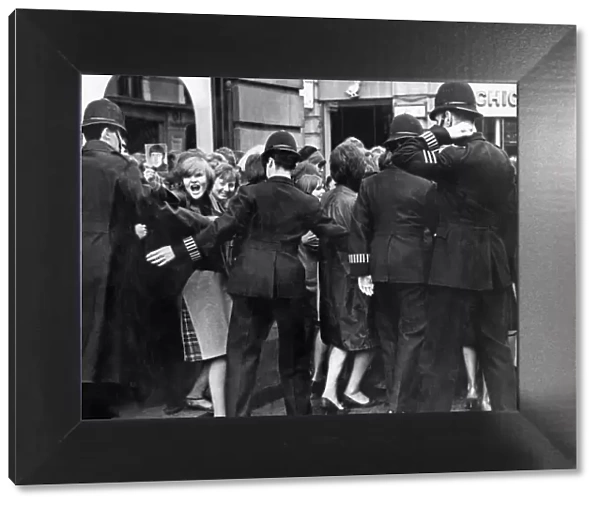 Beatles fans are held back by police