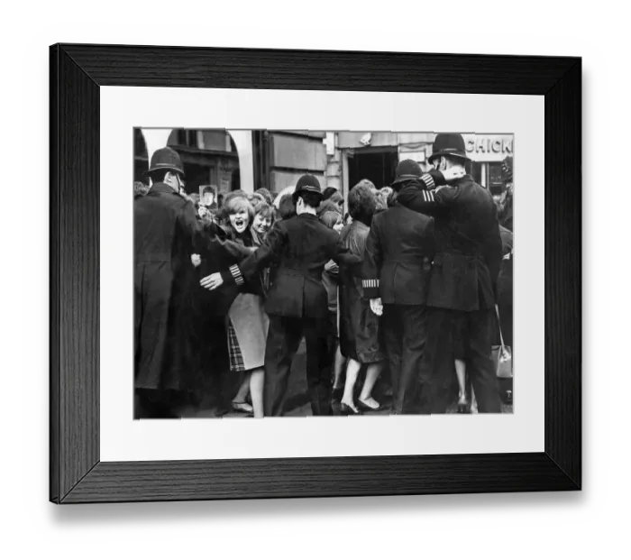 Framed Print : Beatles fans are held back by police Framed Print : Beatles fans are held back by police