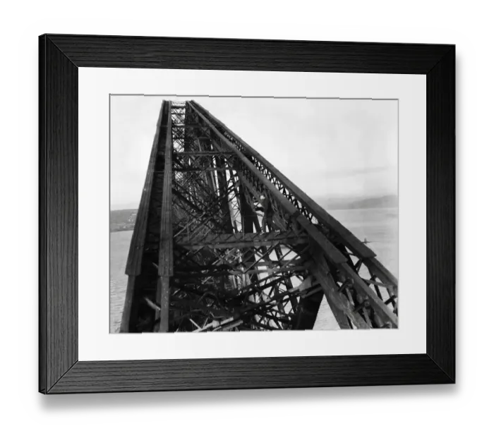 Framed Print : A workman on a giant girder of the Forth Bridge in Scotland. 1931 Framed Print : A workman on a giant girder of the Forth Bridge in Scotland. 1931