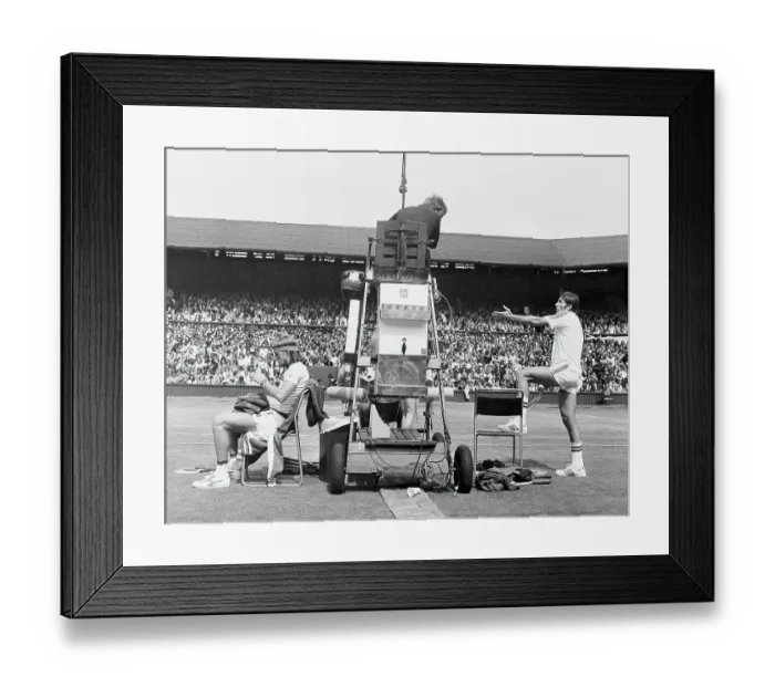 Framed Print : Ilie Nastase, argues with the umpire while Bjorn Borg quietly sits it out Framed Print : Ilie Nastase, argues with the umpire while Bjorn Borg quietly sits it out