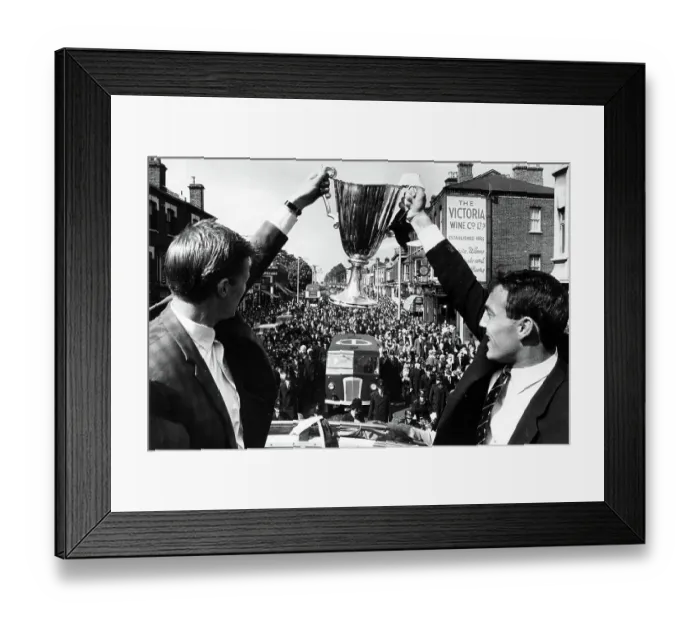 Framed Print : Peter Baker, left, and Jimmy Greaves with the European Cupwinners cup on their victory parade through North London 1963