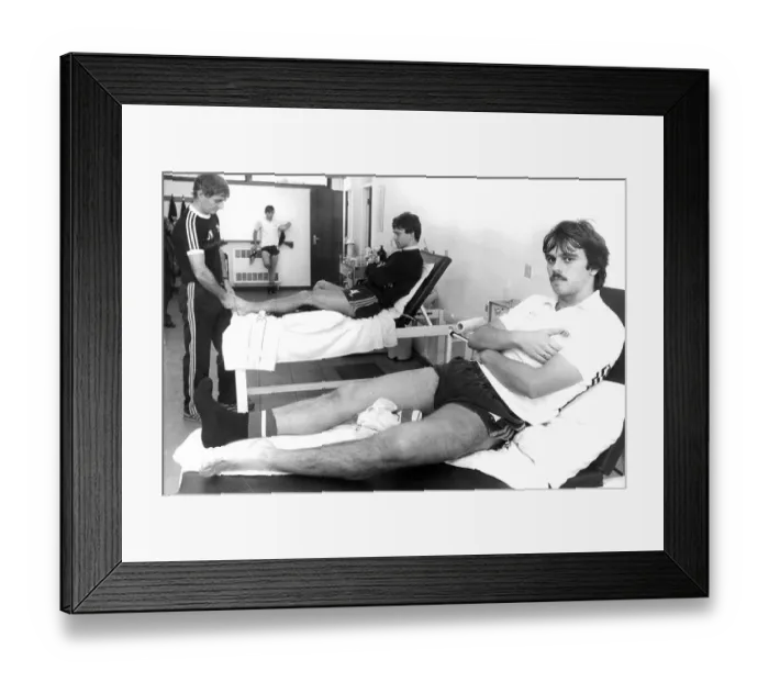 Framed Print : Manchester United F. C. footballers Alan Davies (front) and Bryan Robson having treatment Framed Print : Manchester United F. C. footballers Alan Davies (front) and Bryan Robson having treatment