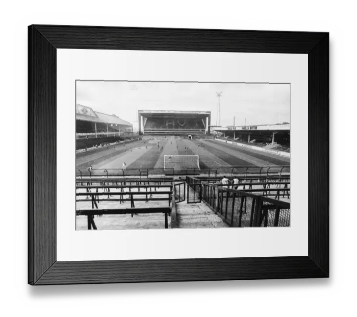 Framed Print : A lone policeman and his dog patrol the empty terraces at Villa Park where Aston Villa were forced by Uefa to play their European Cup tie behind closed doors Framed Print : A lone policeman and his dog patrol the empty terraces at Villa Park where Aston Villa were forced by Uefa to play their European Cup tie behind closed doors