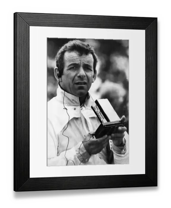 Framed Print : Tony Jacklin, Captain of the European Ryder Cup Team, tunes into the morning scores on his mini television Framed Print : Tony Jacklin, Captain of the European Ryder Cup Team, tunes into the morning scores on his mini television