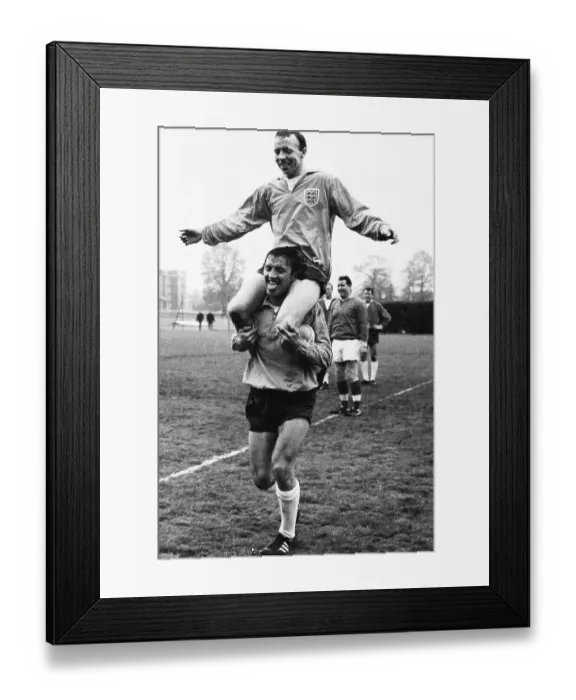 Framed Print : Footballer Nobby Stiles on the shoulders of fellow player Barry Bridges during England training 1965 Framed Print : Footballer Nobby Stiles on the shoulders of fellow player Barry Bridges during England training 1965