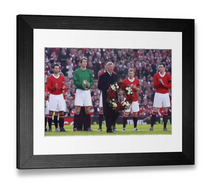 Framed Print : Sir Alex Ferguson holding a wreath to commemorate 50 years since the Munich Air disaster Framed Print : Sir Alex Ferguson holding a wreath to commemorate 50 years since the Munich Air disaster