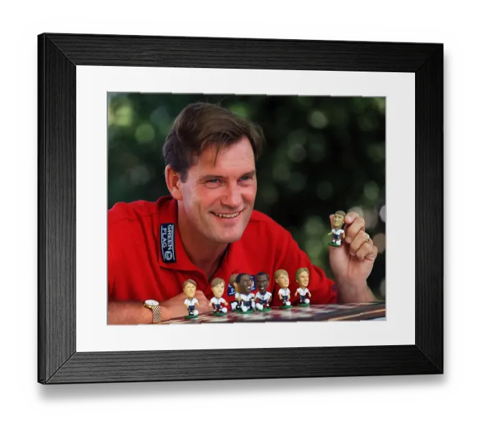 Framed Print : England Manager, Glenn Hoddle playing with miniature figures of the England squad 1997 Framed Print : England Manager, Glenn Hoddle playing with miniature figures of the England squad 1997