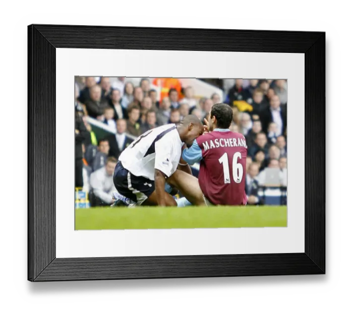 Framed Print : Javier Mascherano of West Ham reacts after after he was bitten by Spurs Jermain Defoe Framed Print : Javier Mascherano of West Ham reacts after after he was bitten by Spurs Jermain Defoe