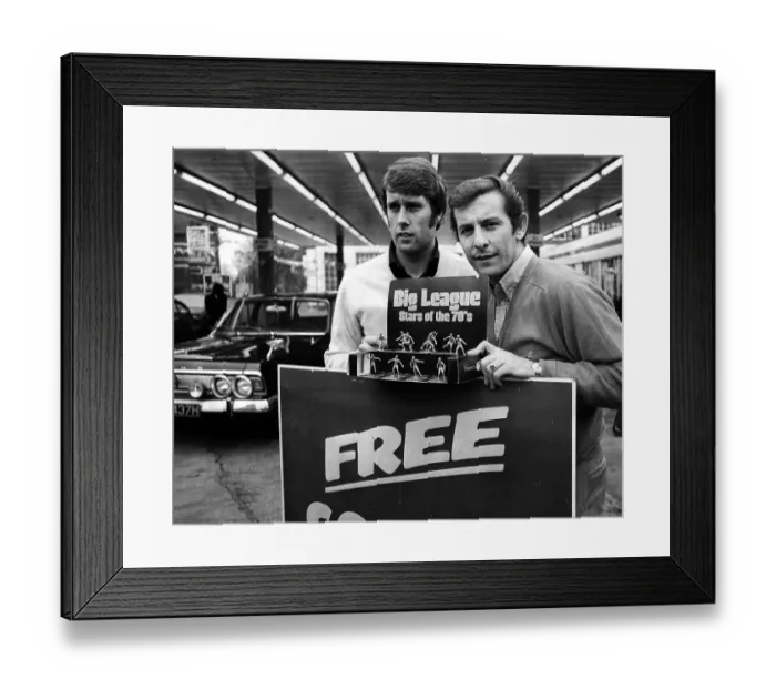 Framed Print : Geoff Hurst and Alan Mullery pose with football figurines in a garage in Acton in 1971 Framed Print : Geoff Hurst and Alan Mullery pose with football figurines in a garage in Acton in 1971