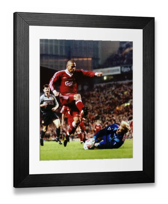 Framed Print : Man Utd's keeper Peter Schmeichel dives to save from Stan Collymore Framed Print : Man Utd's keeper Peter Schmeichel dives to save from Stan Collymore