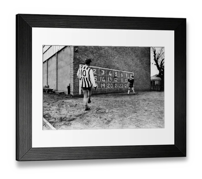 Framed Print : West Bromwich Albion inside forward John Kaye practises scoring against a numbered wall Framed Print : West Bromwich Albion inside forward John Kaye practises scoring against a numbered wall