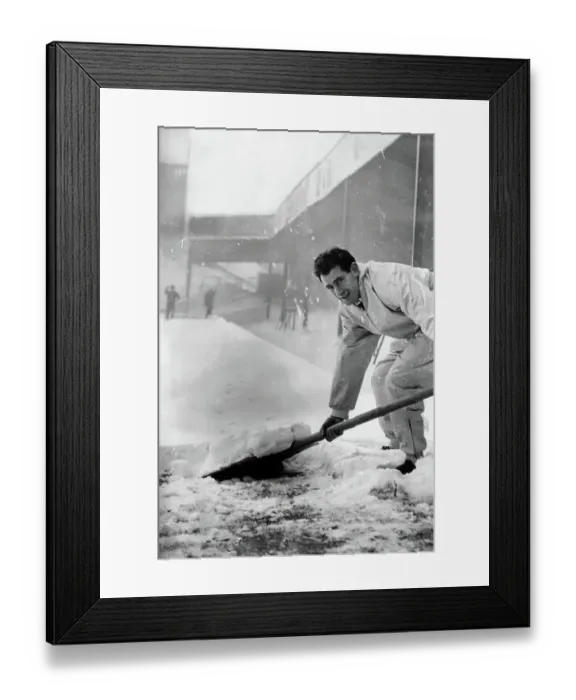 Framed Print : Emilio Aldecoa Birmingham City trainer clearing snow from pitch Framed Print : Emilio Aldecoa Birmingham City trainer clearing snow from pitch