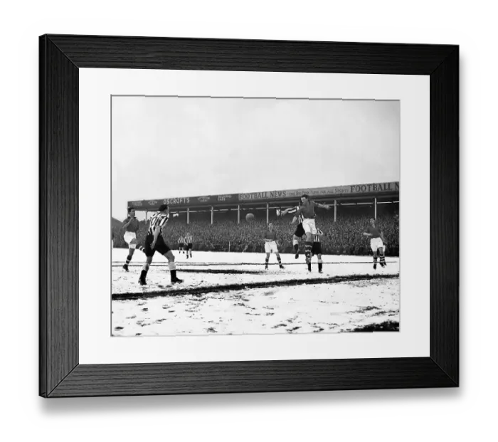 Framed Print : Geoff Thomas jumps high to head clear from Newcastle's centre forward Len White on a snow covered City Ground 1955 Framed Print : Geoff Thomas jumps high to head clear from Newcastle's centre forward Len White on a snow covered City Ground 1955