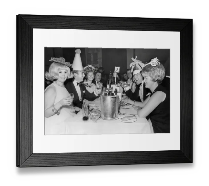Framed Print : Bobby Moore, and wife Tina Moore across the table from Terry Venables and his wife 1967 at a New Years Party