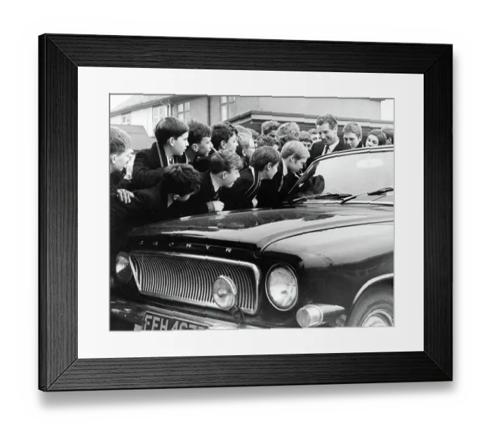 Framed Print : Dudley Kerwick, manager of Nuneaton F.C. with boys of Manor Park Grammar School, listening to the car radio to find out their opponents in the F.A. Cup third round Framed Print : Dudley Kerwick, manager of Nuneaton F.C. with boys of Manor Park Grammar School, listening to the car radio to find out their opponents in the F.A. Cup third round