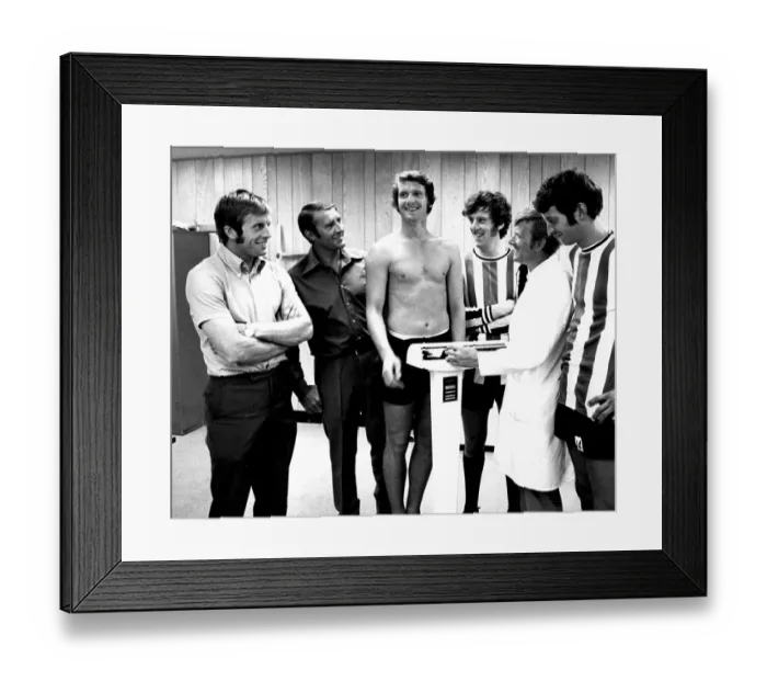 Framed Print : Manchester City player Mike Doyle weighs in Framed Print : Manchester City player Mike Doyle weighs in