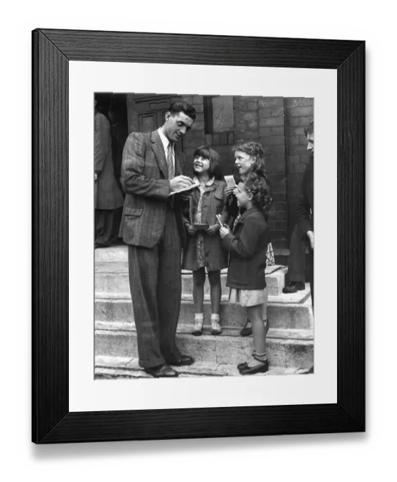 Framed Print : Footballer Eddie McMorran signing autographs 1947 Framed Print : Footballer Eddie McMorran signing autographs 1947