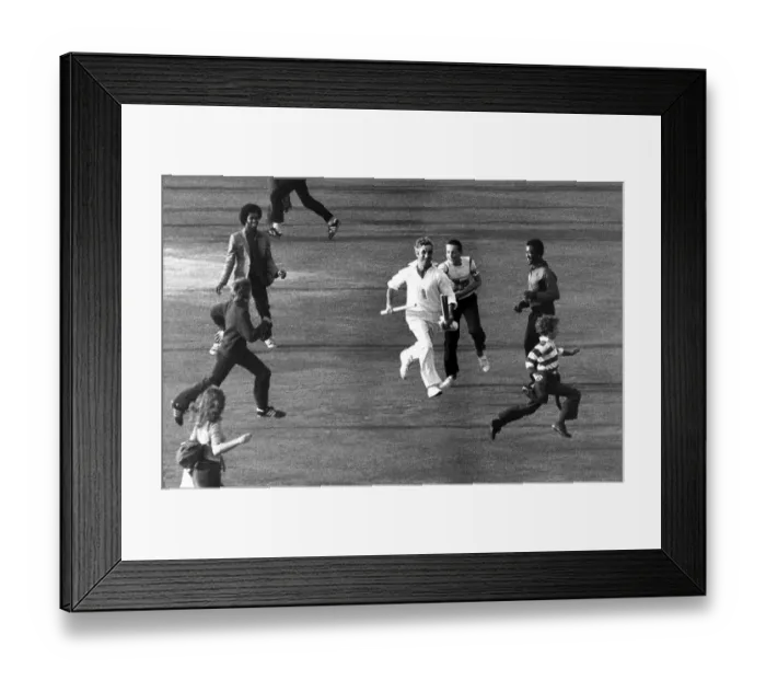 Framed Print : Mike Brearley runs off the pitch holding the cricket stumps Framed Print : Mike Brearley runs off the pitch holding the cricket stumps