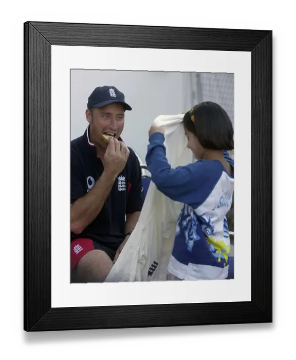 Framed Print : Nasser Hussain gives his shirt to a local girl after the game