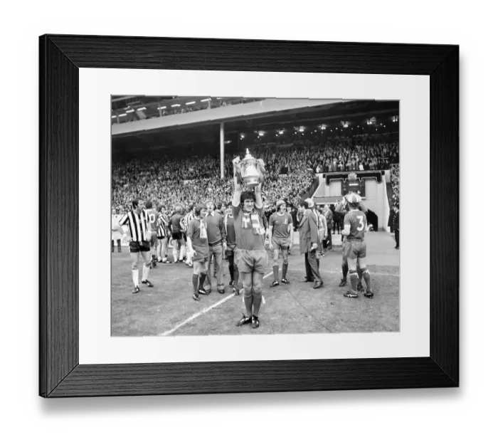 Framed Print : Liverpool v Newcastle United 1974 FA Cup Final at Wembley Stadium. Emlyn Hughes with the Cup for Liverpool Framed Print : Liverpool v Newcastle United 1974 FA Cup Final at Wembley Stadium. Emlyn Hughes with the Cup for Liverpool
