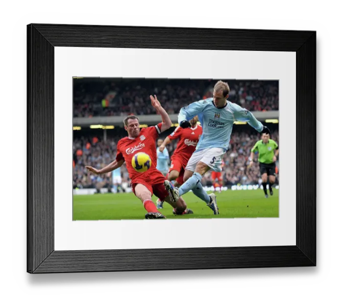 Framed Print : Liverpool's Jamie Carragher tackles Manchester City's Pablo Zabaleta