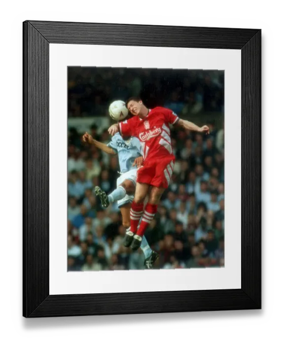 Framed Print : Liverpool's young star Robbie Fowler out jumps Keith Curle, of Manchester City Framed Print : Liverpool's young star Robbie Fowler out jumps Keith Curle, of Manchester City