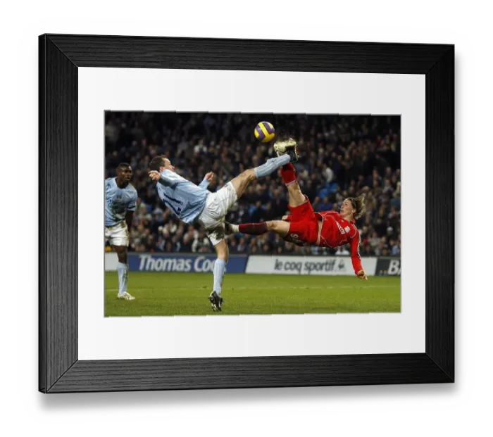 Framed Print : Fernando Torres overhead kick is blocked by Manchester City's Didi Hamann Framed Print : Fernando Torres overhead kick is blocked by Manchester City's Didi Hamann