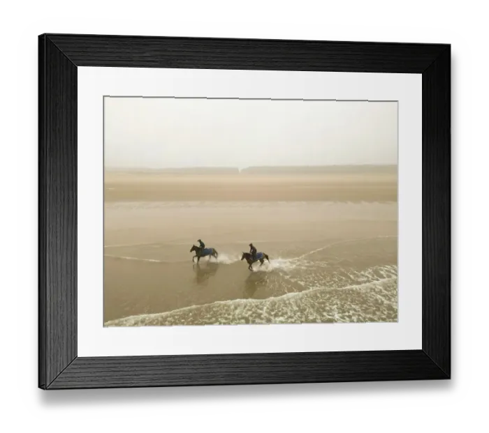 Framed Print : Two horses from the James Owen Racing stables (Newmarket) ride at Holkham beach in Norfolk in a pre-Cheltenham work-out Framed Print : Two horses from the James Owen Racing stables (Newmarket) ride at Holkham beach in Norfolk in a pre-Cheltenham work-out