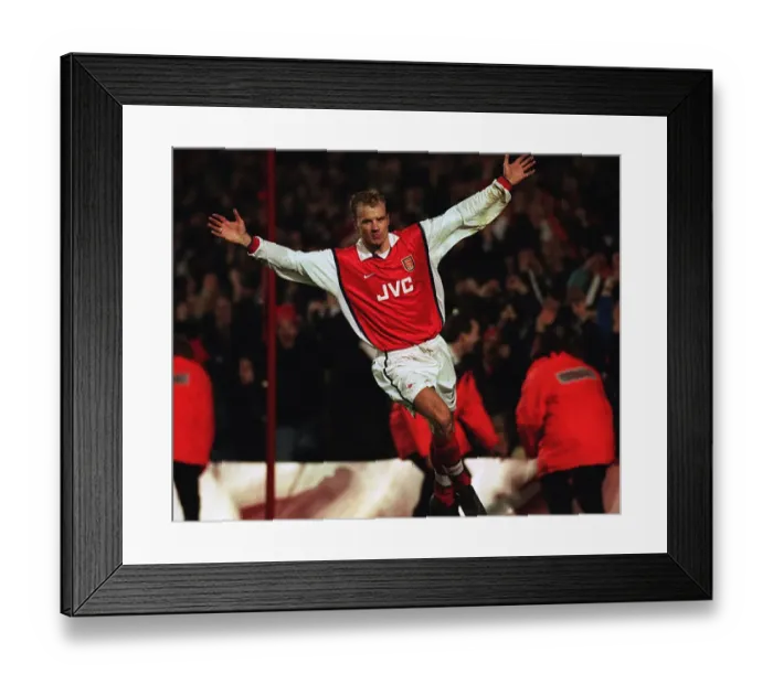 Framed Print : Dennis Bergkamp celebrates scoring for Arsenal Framed Print : Dennis Bergkamp celebrates scoring for Arsenal
