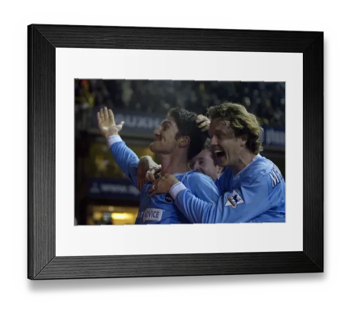 Framed Print : Man City's Jon Macken celebrates his match-winning goal with teammate Steve McManaman 2004 Framed Print : Man City's Jon Macken celebrates his match-winning goal with teammate Steve McManaman 2004