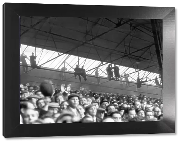 Southampton fans hang from the rafters to watch their side host Nottingham Forest in the FA Cup in 1963