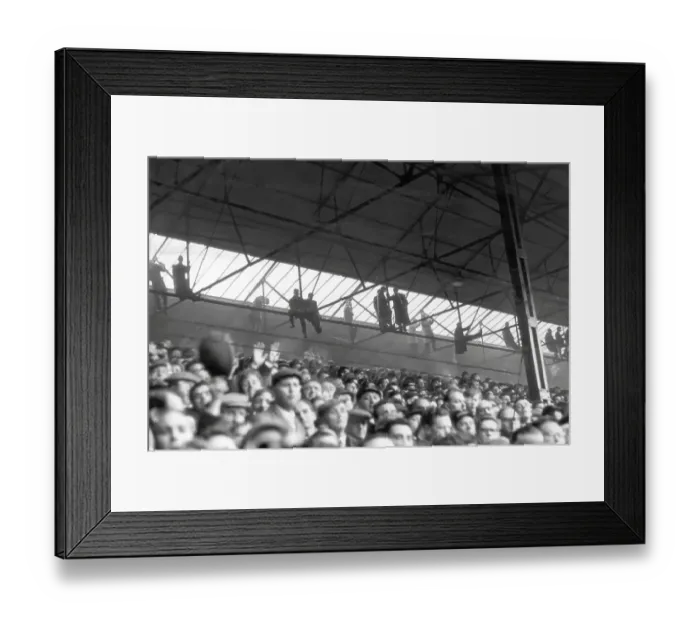 Framed Print : Southampton fans hang from the rafters to watch their side host Nottingham Forest in the FA Cup in 1963 Framed Print : Southampton fans hang from the rafters to watch their side host Nottingham Forest in the FA Cup in 1963
