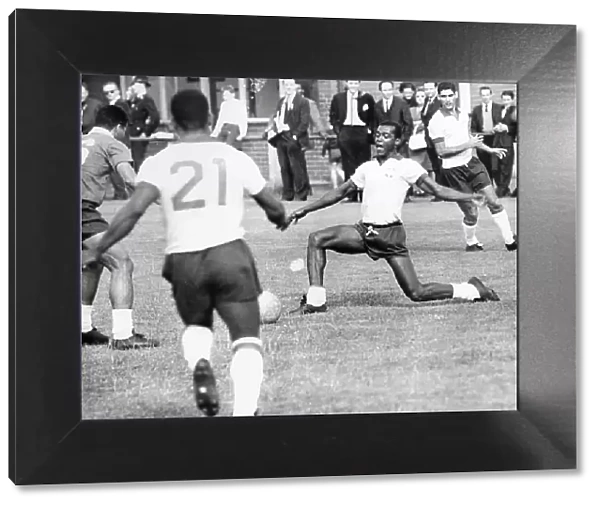 Denilson passes the ball to Pele during Brazilian football team training session for the 1966 World Cup