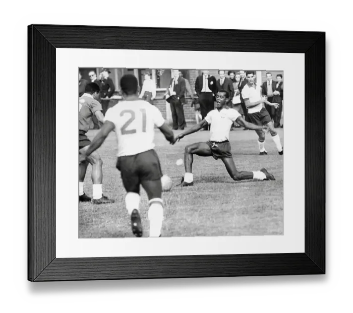 Framed Print : Denilson passes the ball to Pele during Brazilian football team training session for the 1966 World Cup