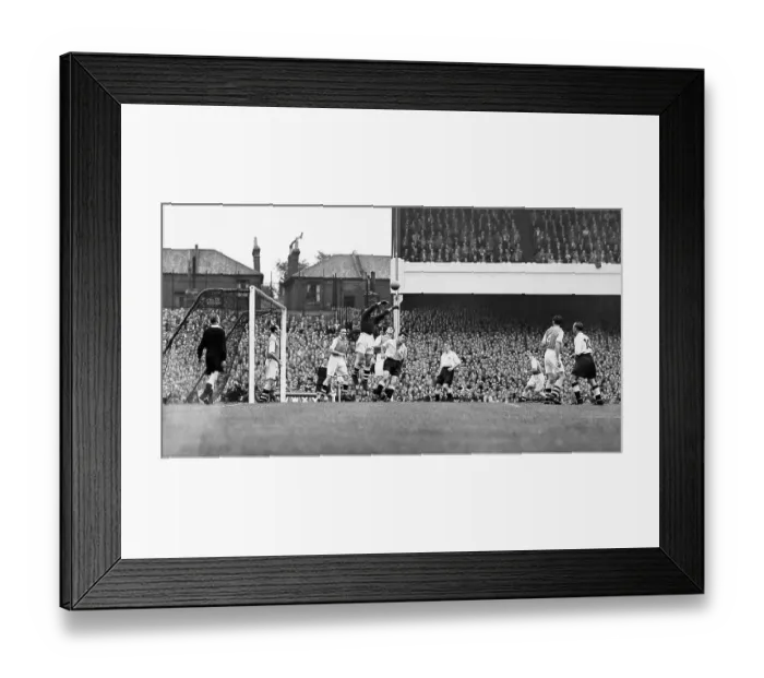 Framed Print : Arsenal's goalkeeper George Swindin clears a cross from the Spurs forwards during the Gunners 2-2 draw at home in 1950 Framed Print : Arsenal's goalkeeper George Swindin clears a cross from the Spurs forwards during the Gunners 2-2 draw at home in 1950