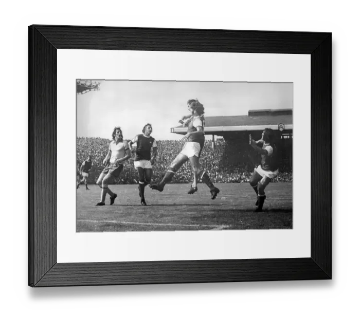 Framed Print : Arsenal's Alan Ball heads for a corner when put under pressure by Manchester United at Highbury Framed Print : Arsenal's Alan Ball heads for a corner when put under pressure by Manchester United at Highbury