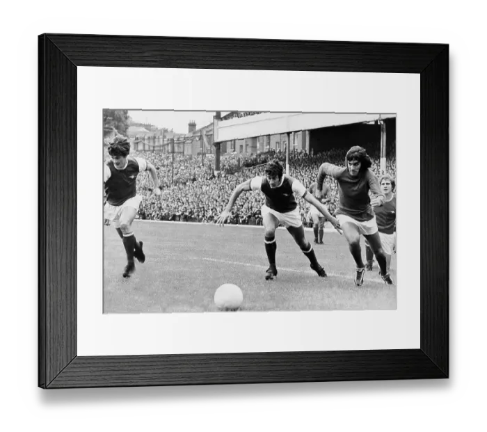 Framed Print : George Best leaves Arsenal's Eddie Kelly and Frank McClintock in his wake. Pat Rice is seen at the far left of the picture Framed Print : George Best leaves Arsenal's Eddie Kelly and Frank McClintock in his wake. Pat Rice is seen at the far left of the picture