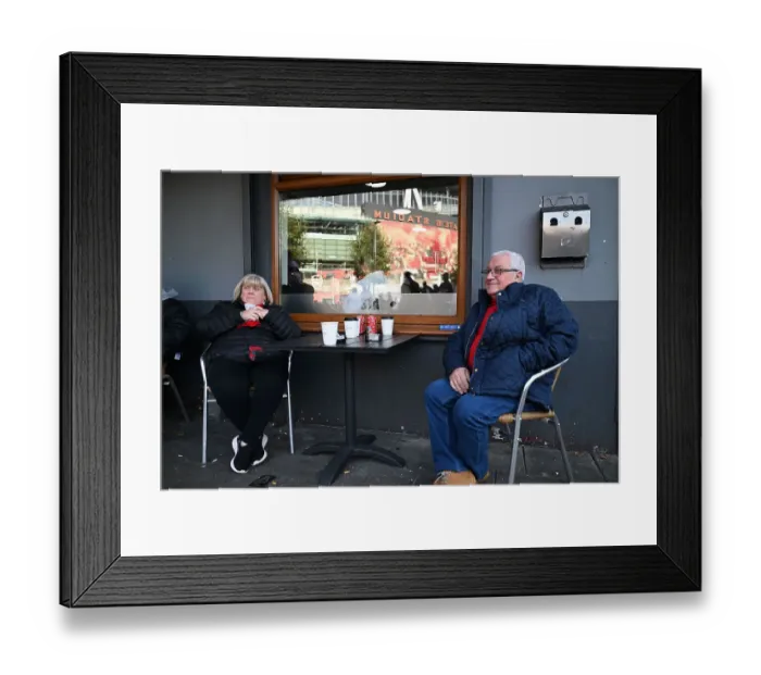 Framed Print : Arsenal fans outside the cafe outside the Emirates Framed Print : Arsenal fans outside the cafe outside the Emirates