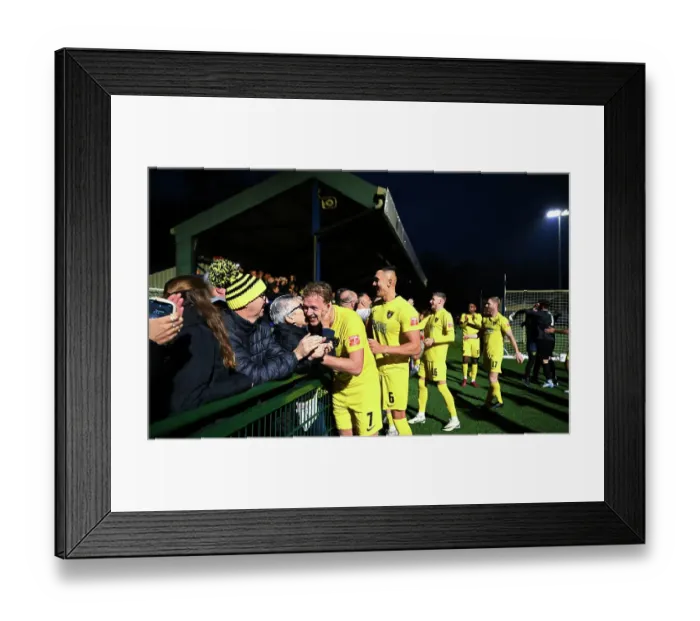 Framed Print : Harborough Town players celebrate with their fans