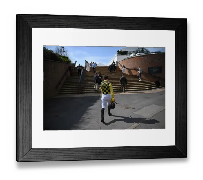 Framed Print : A jockey walking back to the weighing room after racing. 2025 Grand National Aintree