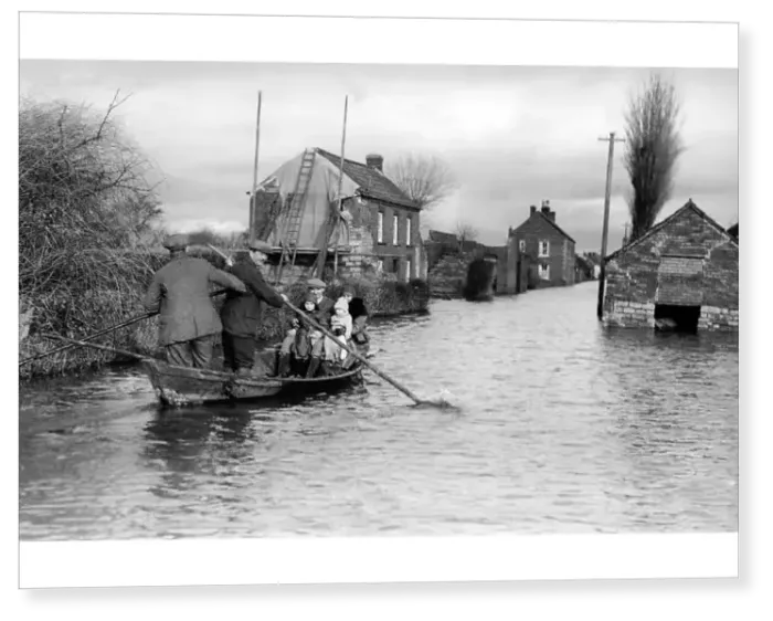 Print : Flood in Athenley, Somerset, with a boat floating down main street, 1929