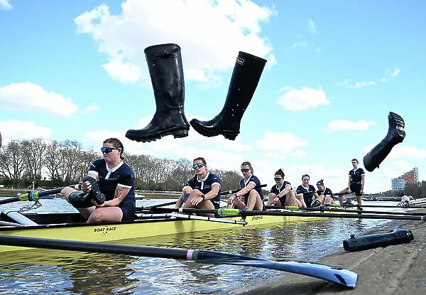 2024 Boat Race Crew throwing their boots ashore