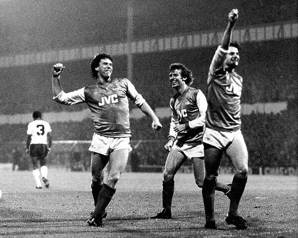 Arsenal footballers Tony Woodcock, Graham Rix and Charlie Nicholas celebrate their 1-2 win over Spurs